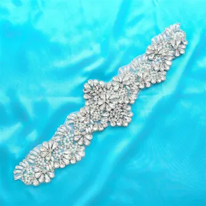 Exquisite bridal rhinestone applique detail shot, sparkling crystals and pearls for wedding dress.