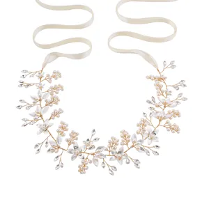 Gold bridal hair vine with pearls crystals and white ribbons for wedding party styling.