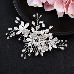 Detailed view of silver bridal hair comb with crystal flowers and leaves accessory