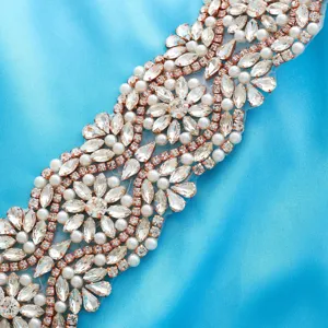 Exquisite rhinestone bridal belt applique with pearls and rose gold setting for wedding dress.