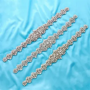 Close-up detail of exquisite rhinestone crystal appliques in silver, gold, and rose gold variants.