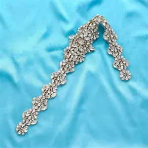 Detailed shot of sparkling rhinestone floral applique for bridal dress and DIY sash design.