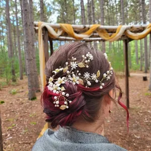 European and American bridal hair vine with white flowers, gold leaves and pearls for wedding styling.