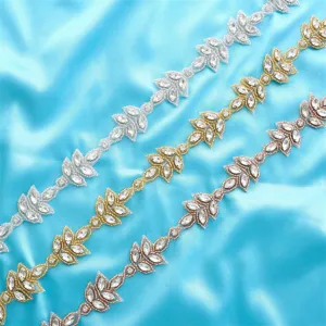 Detail shot of rhinestone trim appliques in silver, gold, and rose gold for wedding dresses.