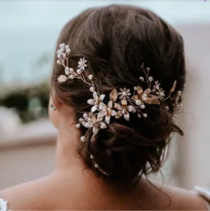 Close-up view of the elegant bridal floral and pearl hair vine, highlighting intricate details.