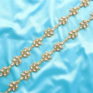 Exquisite rhinestone applique trim, crystal leaf bridal dress belt accessory detail view.