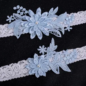Beautiful light blue lace garter set with elegant beaded pearl flowers for bridal weddings.