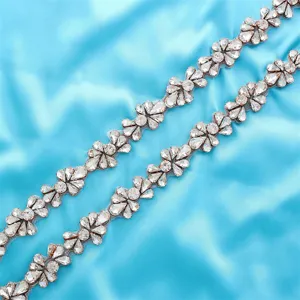 Exquisite rhinestone applique detail showcasing sparkling crystal floral patterns for bridal gowns.