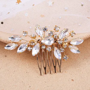 Detailed view of gold rhinestone bridal hair comb, elegant crystal leaf hair accessory for weddings.
