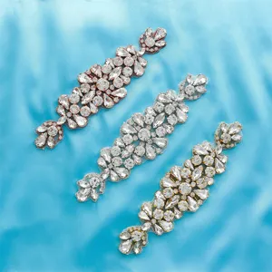 Close-up detail of sparkling rhinestone applique trim for wedding bridal belt dress decoration.