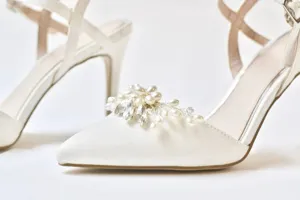 Handmade pearl rhinestone shoe clip detail, elegant bridal wedding footwear decoration accessory.