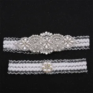 Detailed view of the elegant rhinestone lace bridal garter set, sparkling crystal wedding leg ring.