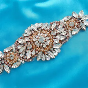 Bridal crystal rhinestone applique close up, shiny diamond trim detail for wedding dress.