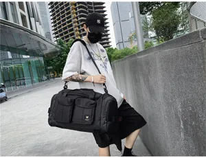 Large capacity black travel duffel bag for men and women, perfect for gym, business trips and sports.