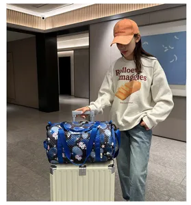 Duffel travel gym bag for women, waterproof sports fitness bag with unicorn print and straps.