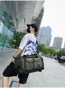 Large capacity travel duffel bag for men, multi-pocket tactical fitness shoulder bag.