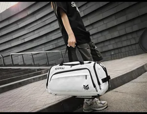 Detailed view of large capacity sports travel duffel bag with wet dry separation and durable handles.