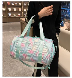 Cute unicorn pattern cylindrical sports duffel bag with shoulder strap for gym and travel use.