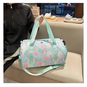 Gradient quilted duffel bag detail, pastel unicorn print design with green straps for gym travel.