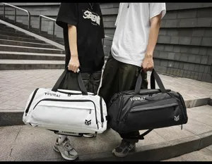 Outdoor lifestyle detail of large capacity duffel bag with wet dry separation and straps.