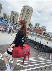 Red multifunctional travel duffel bag, large capacity waterproof sports gym bag for short trips.