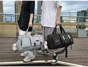 Multifunctional waterproof travel duffel bag for sports and fitness, large capacity design.