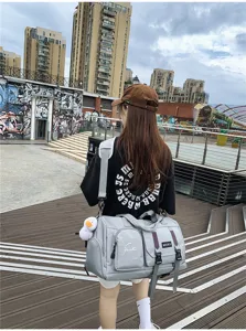Outdoor travel duffel bag detail showcasing multi-pocket design, durable straps and sturdy buckle.