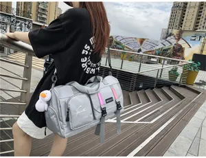 Multifunctional travel duffel bag for sports and fitness, large capacity waterproof luggage.