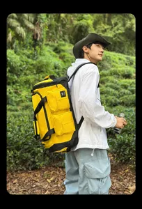 Outdoor multi-functional sports duffel backpack detail shot, showing spacious yellow design.