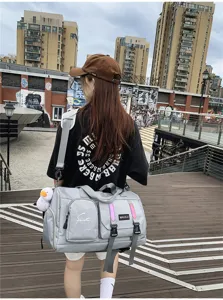Multifunctional large capacity travel sports duffel bag, lightweight waterproof gym luggage.