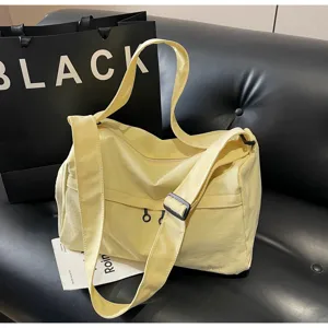 Sac bandoulière en toile jaune clair sac de voyage sport avec sangle réglable et poche.