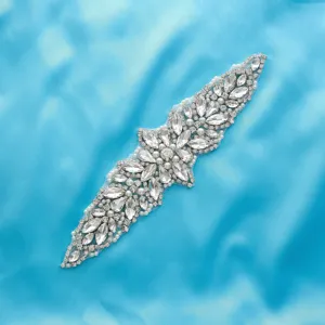 Exquisite rhinestone bridal belt applique detail, sparkling crystals and pearls, elegant design.