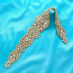 Exquisite bridal rhinestone belt applique with sparkling crystals and pearls for wedding dress.