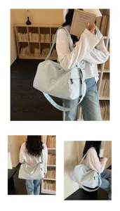 Light blue travel fitness bag detail showcasing large capacity and durable strap design.