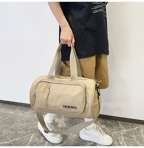 Casual beige travel duffel bag for gym, fitness, and daily trips with shoulder strap.