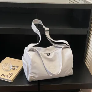 Lightweight grey sports duffel bag with large capacity, perfect for gym, travel and outdoor use.