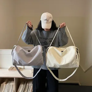 Large capacity travel gym bag for women, lightweight waterproof duffel bag for sports and weekend trips.