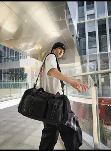 Large capacity black travel duffel bag for men and women, ideal for gym, commuting, and short trips.