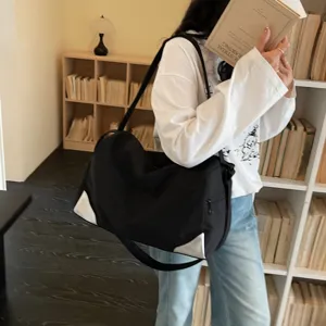 Large capacity black sports gym bag with stylish white corner patches for daily travel and fitness.