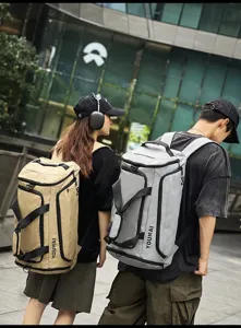 Large capacity travel backpack, multifunctional outdoor sports fitness bag, stylish grey and beige design.
