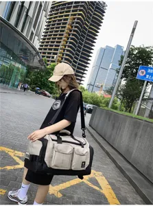 Large capacity travel duffel bag for men and women, multi-pocket outdoor shoulder sports gym bag.