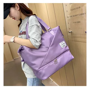 Large capacity travel duffel bag for women, lightweight fitness gym bag with wet dry compartment.