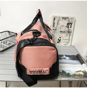 Large capacity pink black travel duffel bag for gym fitness sports and outdoor business trips.