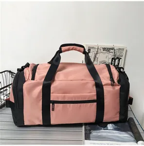Detailed view of the pink and black large capacity travel duffel gym bag for daily sports.