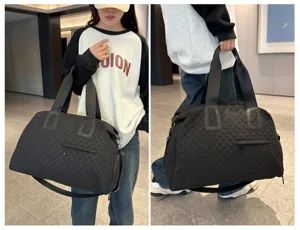 Large capacity black quilted travel duffel bag for women, ideal for fitness and outdoor trips.