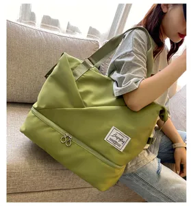 Green travel duffel bag for women, large capacity gym bag with shoe compartment and wet pocket.