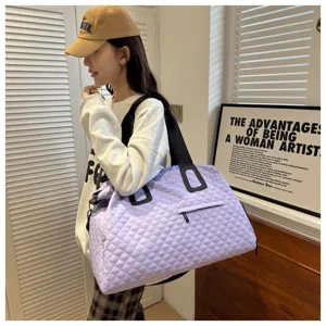 Large capacity quilted travel duffel bag for women, stylish shoulder gym bag with zipper.