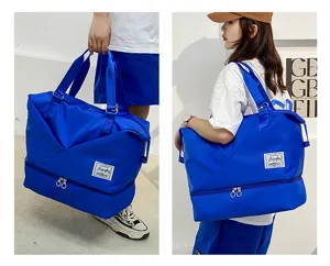 Detail shot of the royal blue travel duffel bag showing its large capacity and bottom wet-dry compartment.