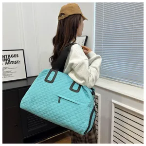 Large capacity quilted travel bag detail shot, cyan shoulder bag for women, casual fitness bag.