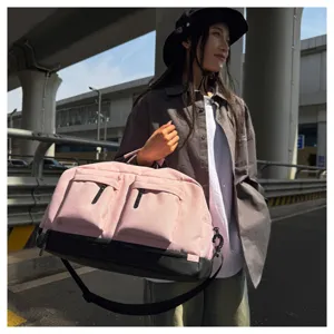 Pink large capacity travel duffel bag detail view, multi-pocket functional design.